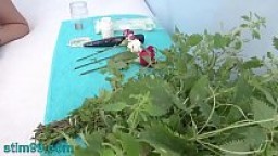 Extreme female inserting nettles into cervix and rod flowers