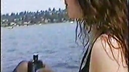 Lesbians fucking with a strap on on a boat