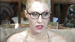 Blond MILF stockings glasses couch bang